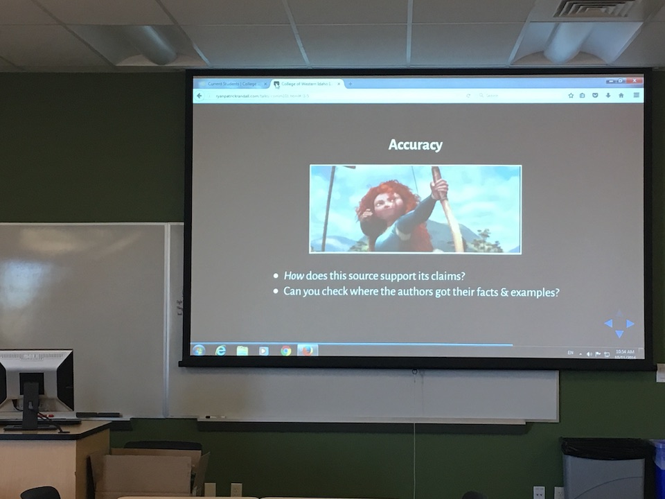 instruction room, with slide about CRAAP test and accuracy, illustrated with a gif of Merida shooting an arrow